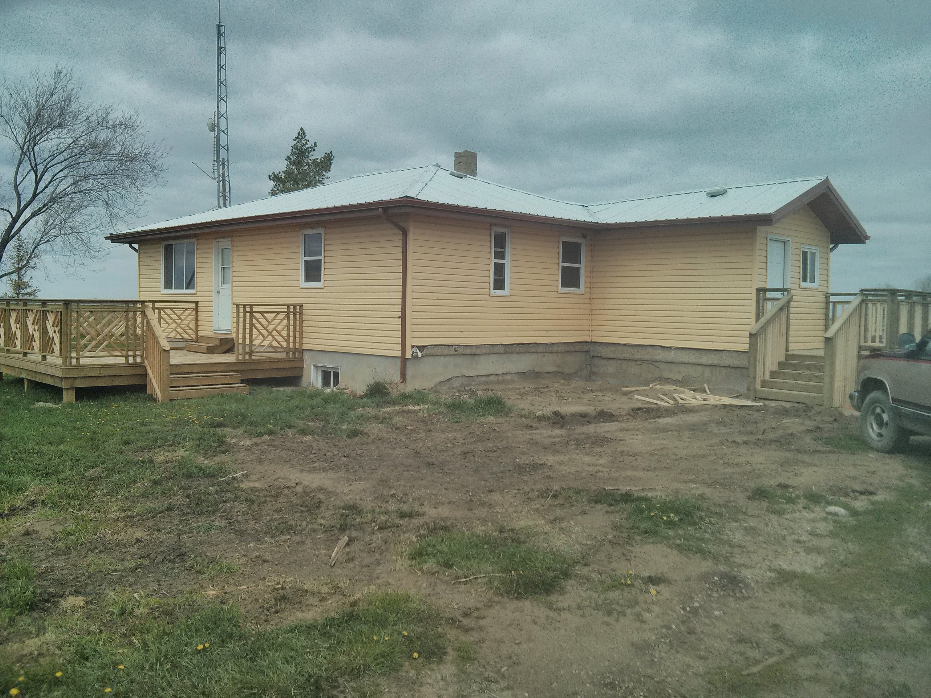 Full Yellow Farmhouse — Deck Complete