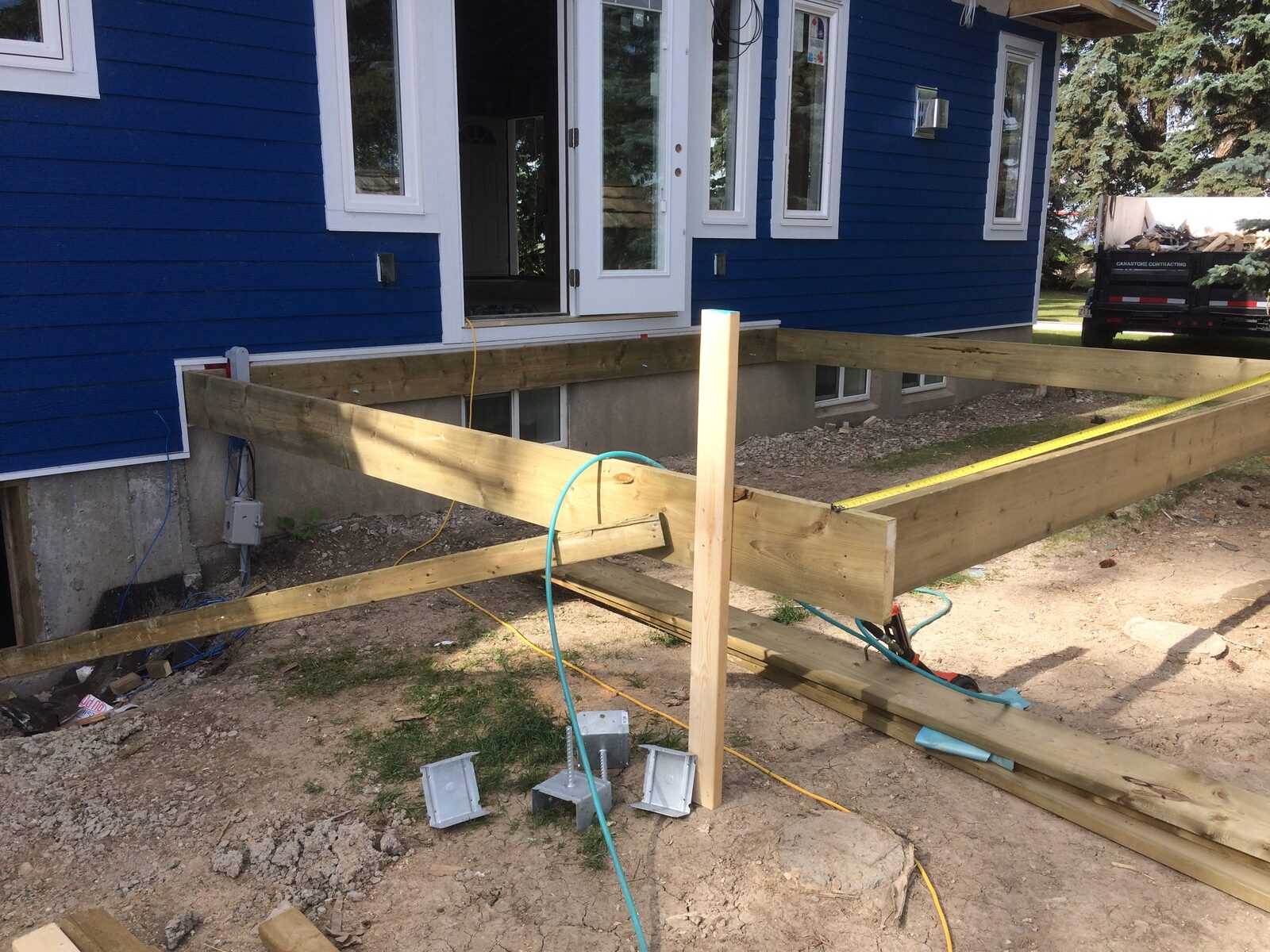 Blue Siding Home — New Patio Doors & Deck Framing